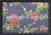 Red blossoms and green leaves embossed denim